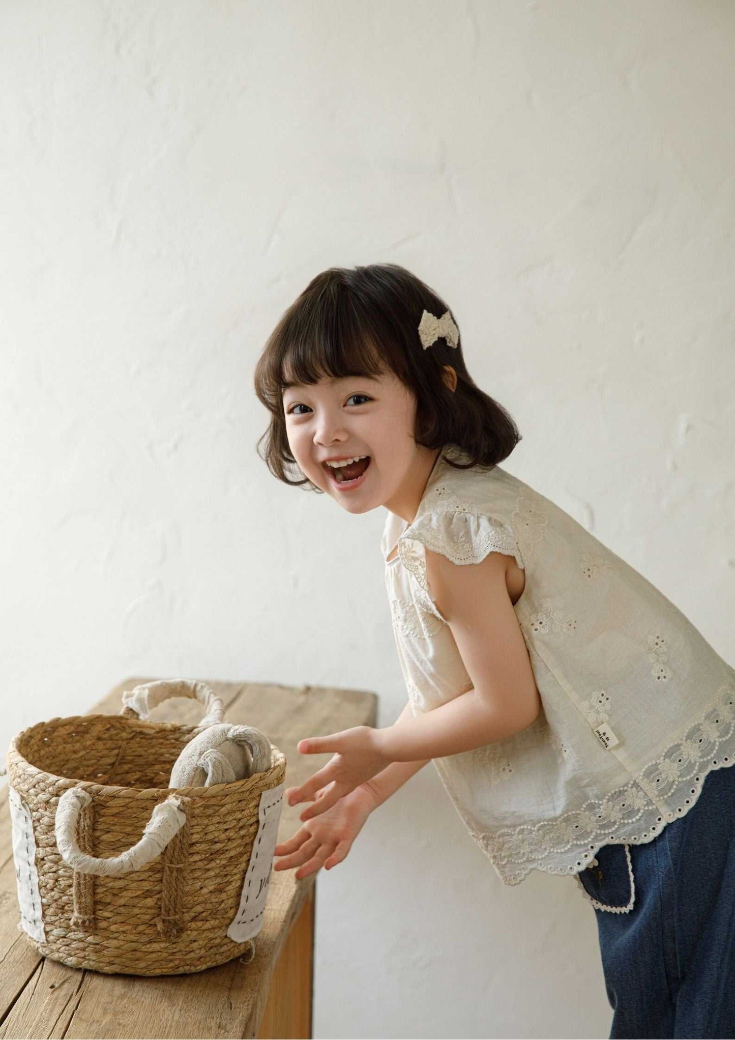 Girls embroidered cotton beige sleeveless top with floral embroidery and ruffle sleeves