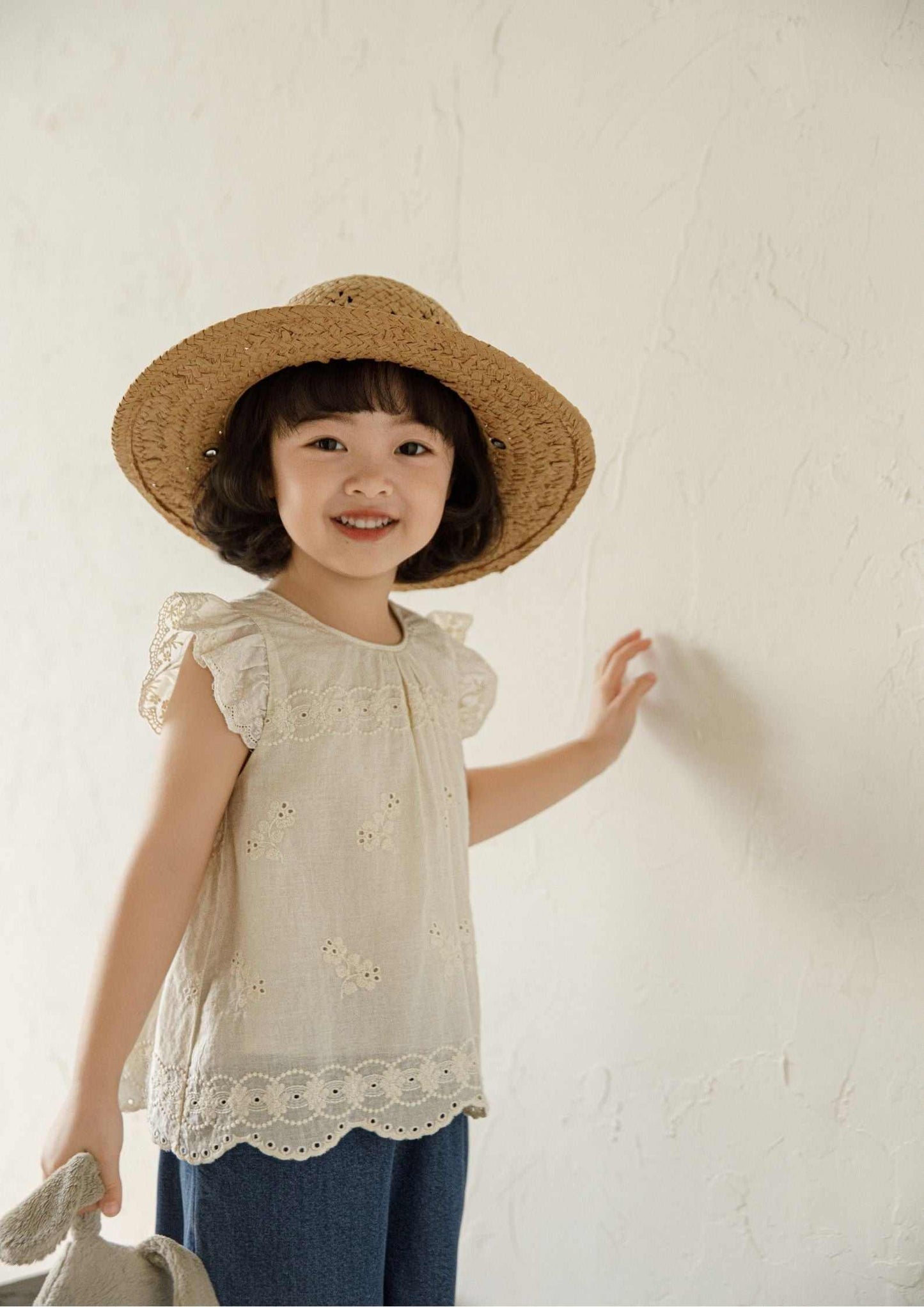 Girls embroidered cotton sleeveless beige floral top with ruffle sleeves and scalloped hem