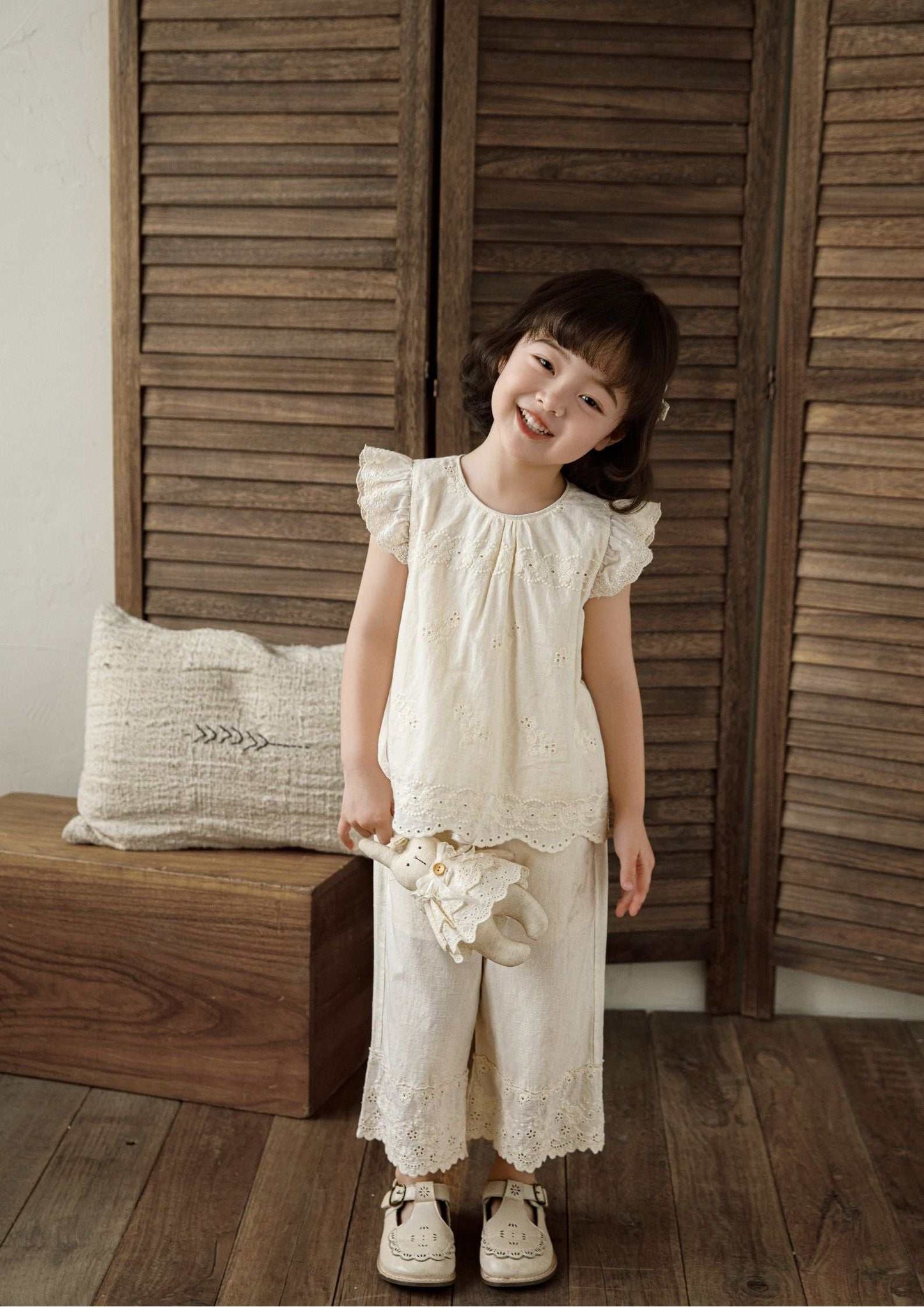 Girls embroidered cotton beige sleeveless top with floral embroidery and ruffle sleeves