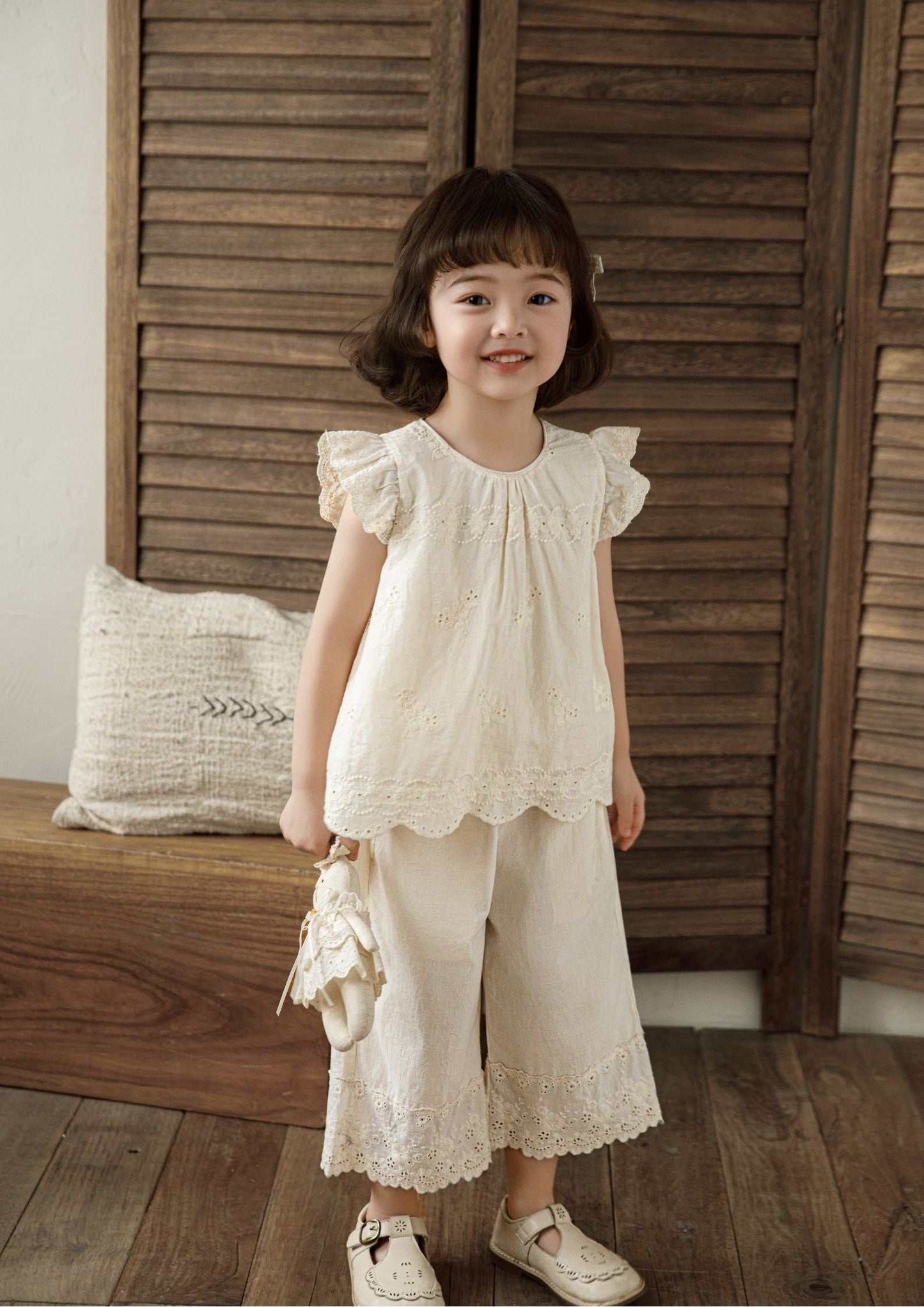 Girls embroidered cotton sleeveless beige floral top with ruffle sleeves and scalloped hem